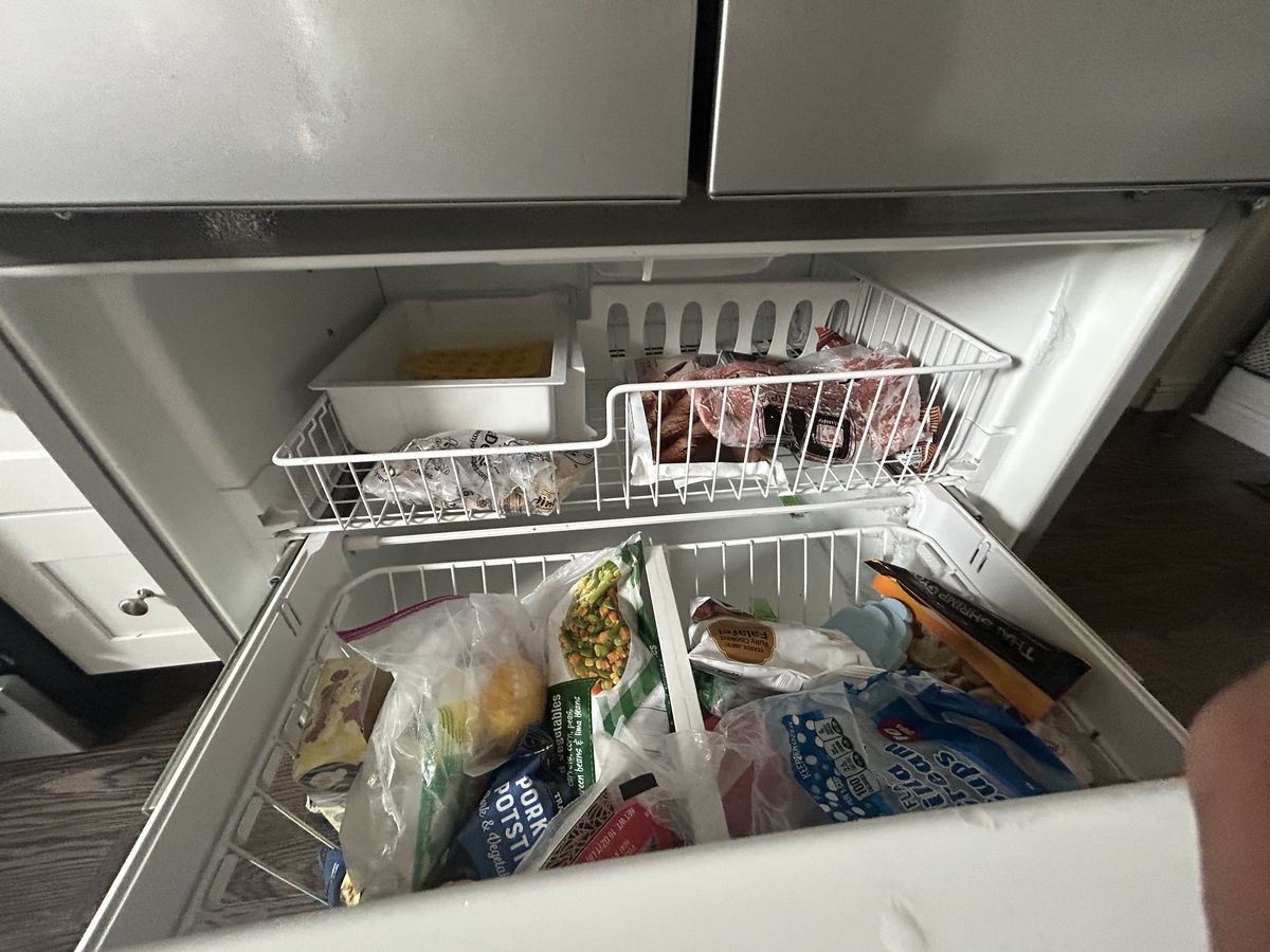 Bottom freezer drawer pulled open during service